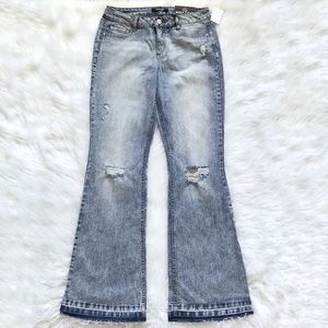 Refuge flare leg Jeans stonewash distress size 8.